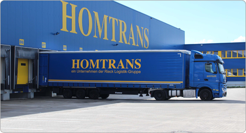 HOMTRANS Truck bei Logistikzentrum